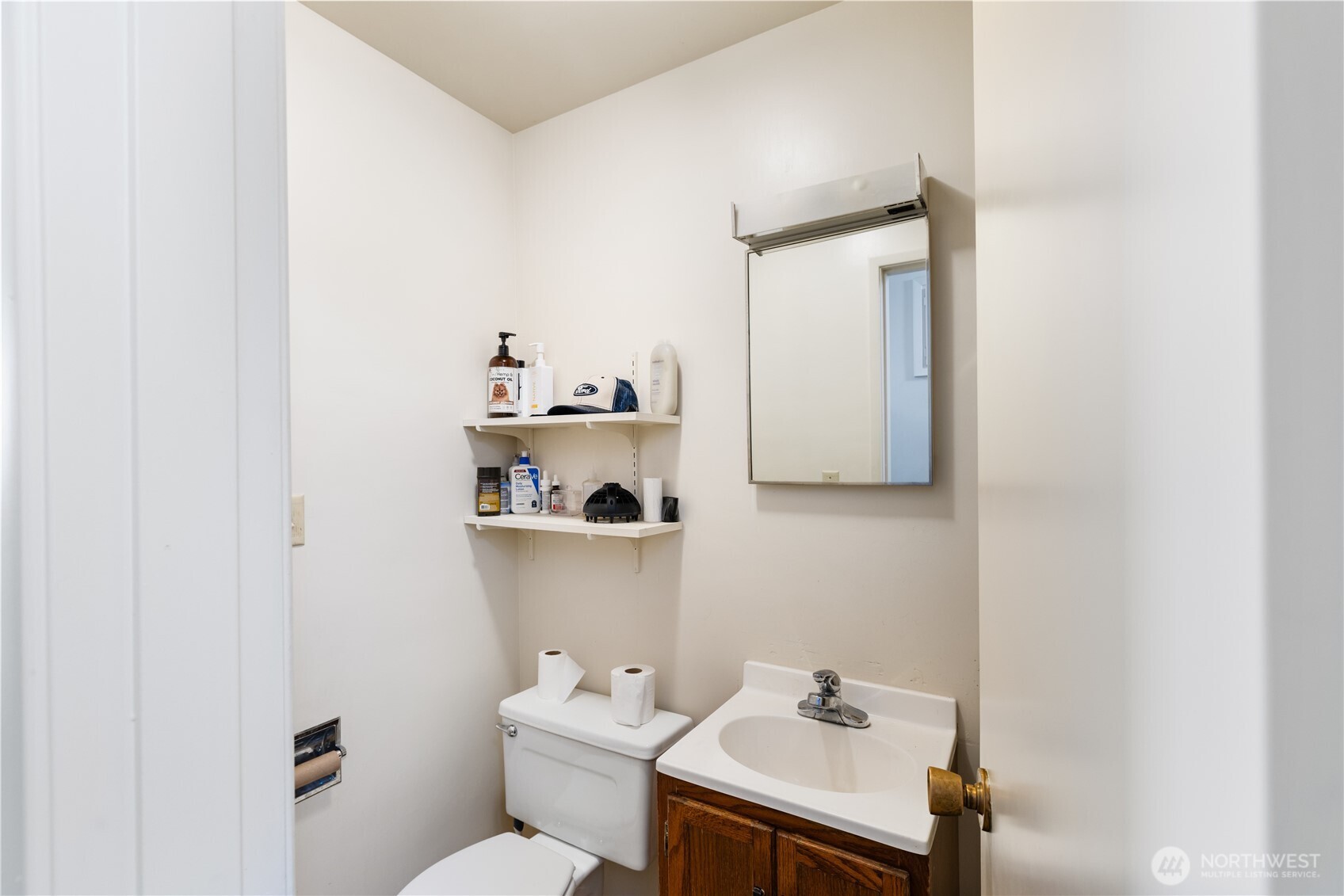 21563-21567 Cook Road Sedro-Woolley, WA 98284 - Photo 18 of 38 a bathroom with a sink toilet and mirror