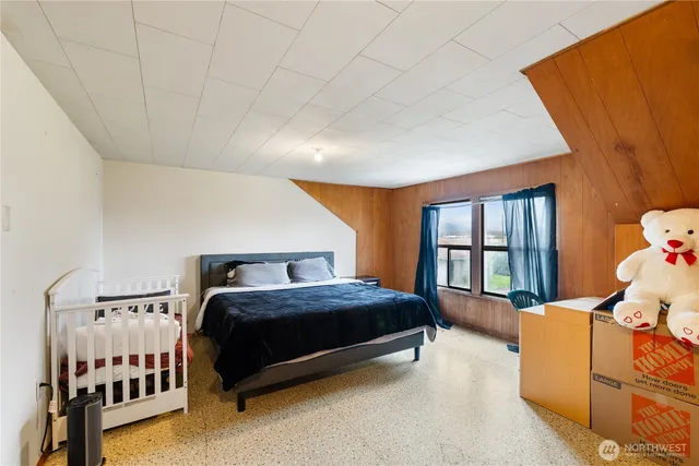 a view of a room with wooden walls