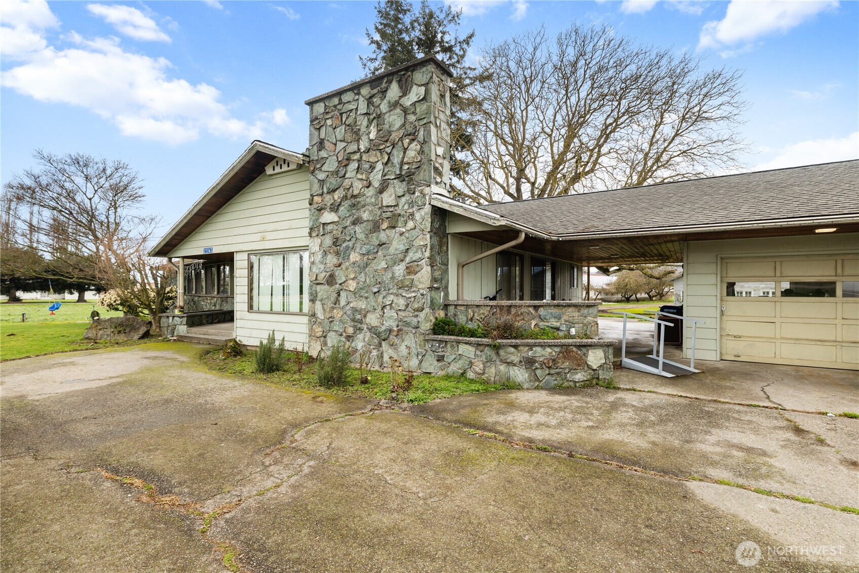21563-21567 Cook Road Sedro-Woolley, WA 98284 - Photo 4 of 38 a view of a house with backyard and a tree