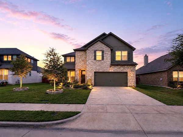 a front view of a house with yard