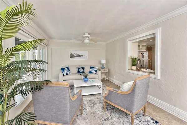 a living room with furniture and a rug