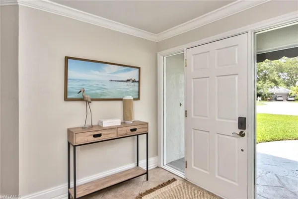 a view of front door with wooden floor