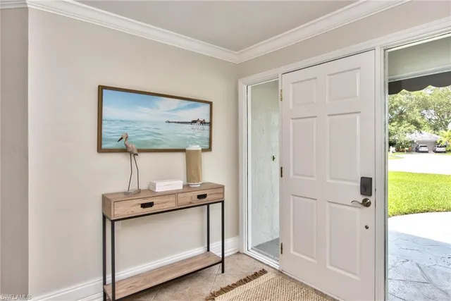 a view of front door with wooden floor