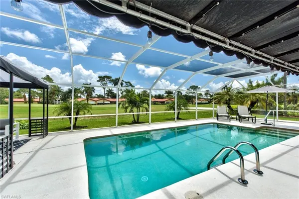 a view of a chairs and table in patio