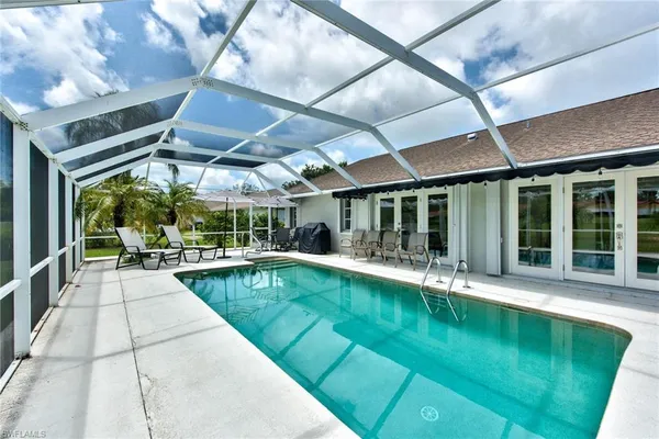 a view of a swimming pool with a patio