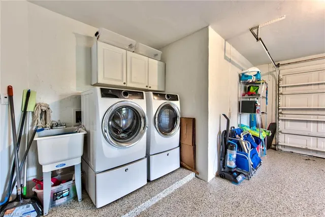 a view of a storage & utility room with washer and dryer