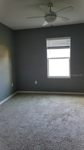 a view of an empty room and a window