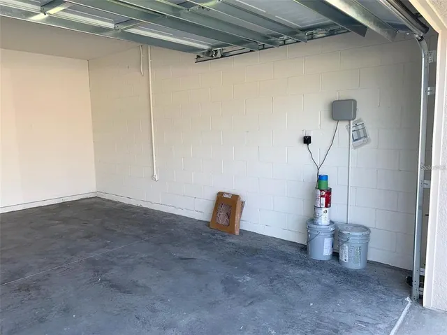 a room with water heater and stairs