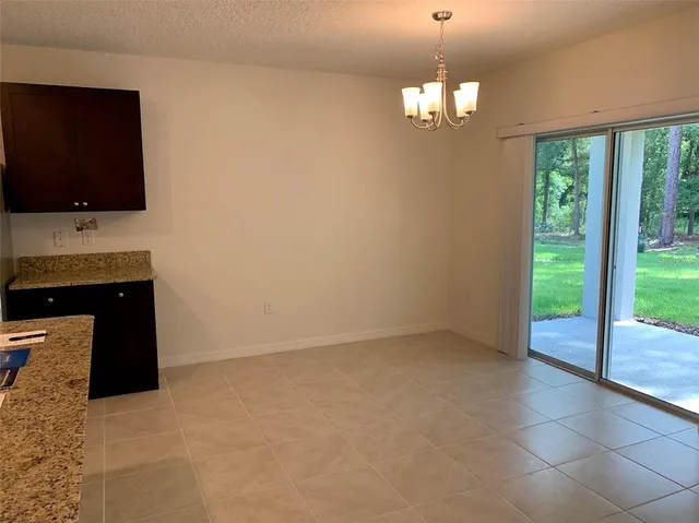 a room with a flat screen tv and a large window