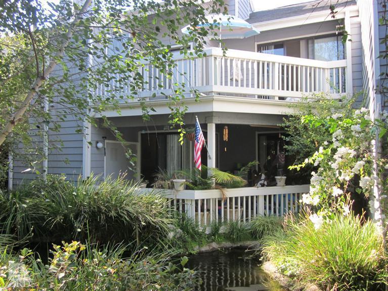 735 Arneill Road Camarillo, CA 93010 - Photo 1 of 21 a view of a house with brick walls and flower garden