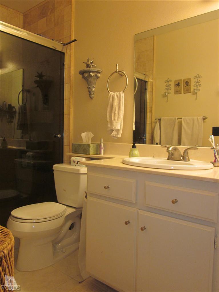 735 Arneill Road Camarillo, CA 93010 - Photo 12 of 21 a bathroom with a sink toilet and shower
