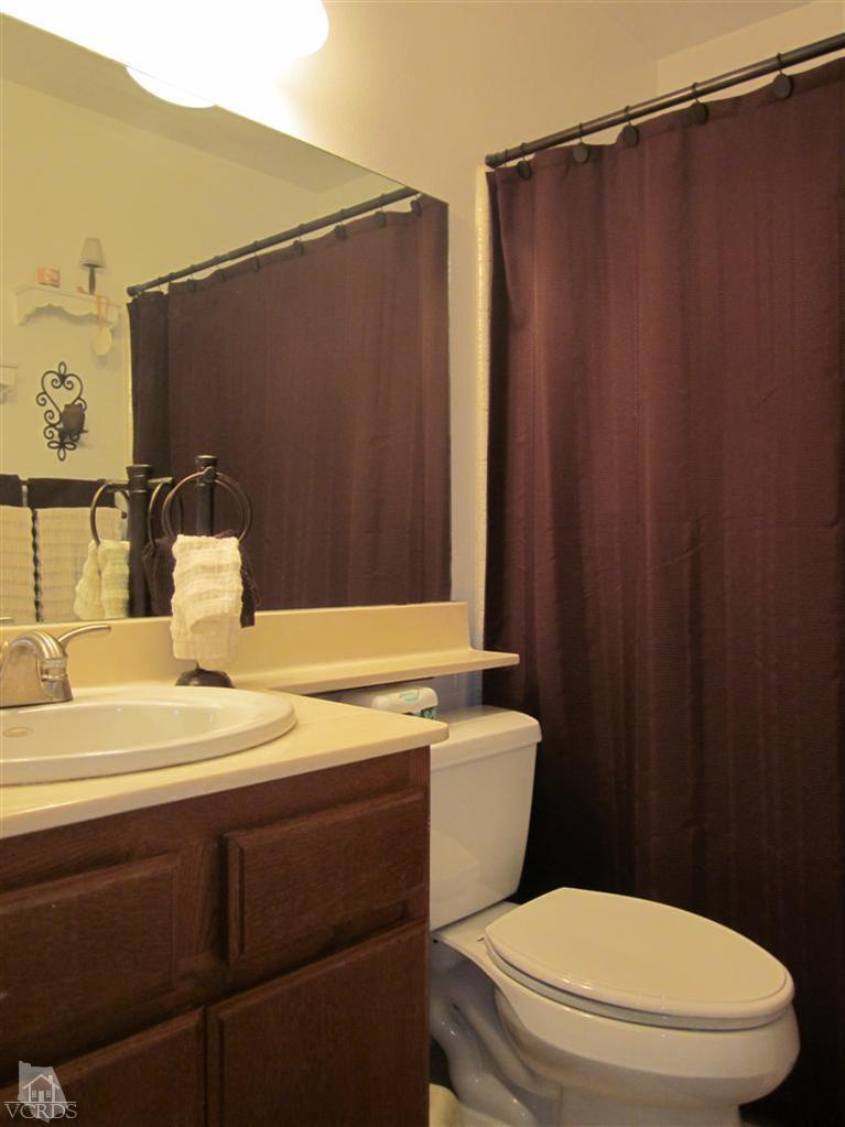 735 Arneill Road Camarillo, CA 93010 - Photo 14 of 21 a bathroom with a sink a toilet and shower