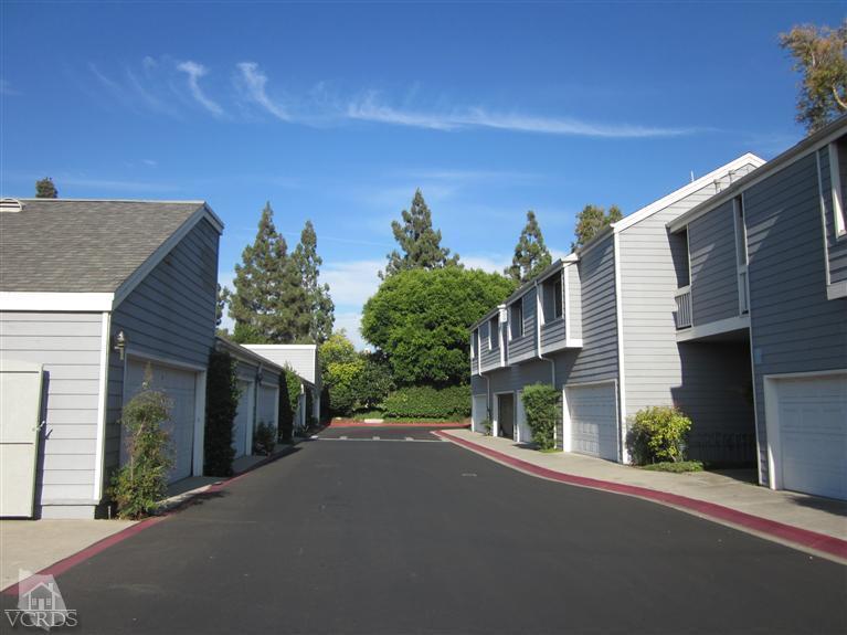 735 Arneill Road Camarillo, CA 93010 - Photo 19 of 21 a front view of a house with a yard and garage