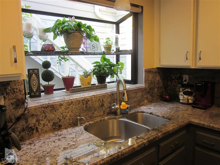 735 Arneill Road Camarillo, CA 93010 - Photo 3 of 21 a kitchen with a sink and a large window