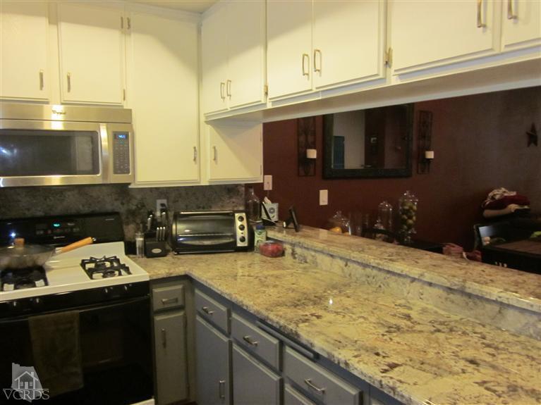 735 Arneill Road Camarillo, CA 93010 - Photo 5 of 21 a kitchen with a stove and a microwave