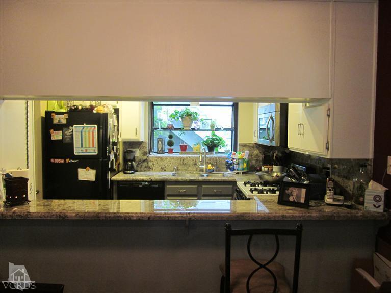 735 Arneill Road Camarillo, CA 93010 - Photo 6 of 21 a kitchen with a sink and large window