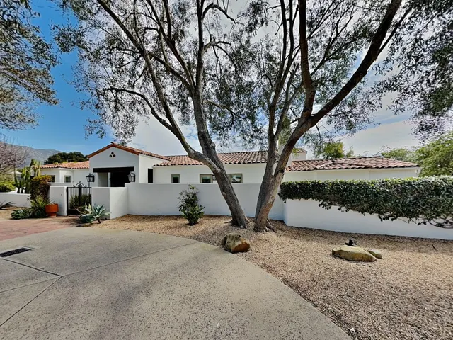 a view of a house with a snow in the yard