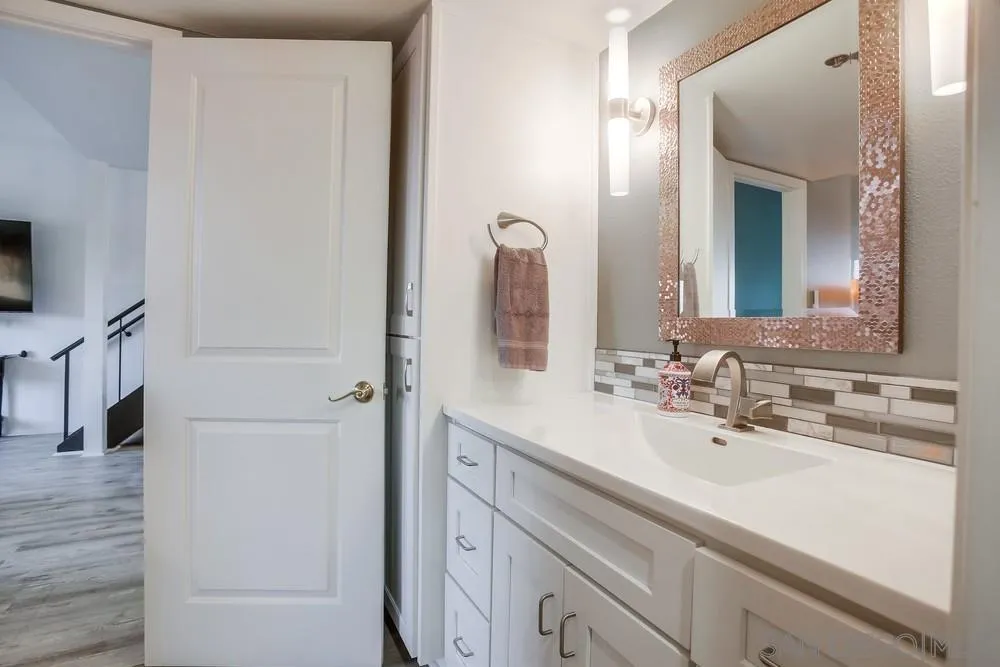 157 Mangano Circle Encinitas, CA 92024 - Photo 13 of 28 a bathroom with a sink and a mirror