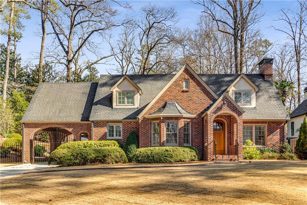 1095 Rosedale Road Northeast Atlanta, GA 30306 - Photo 1 of 1 a front view of a house with a yard