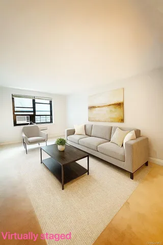 a living room with furniture and a window