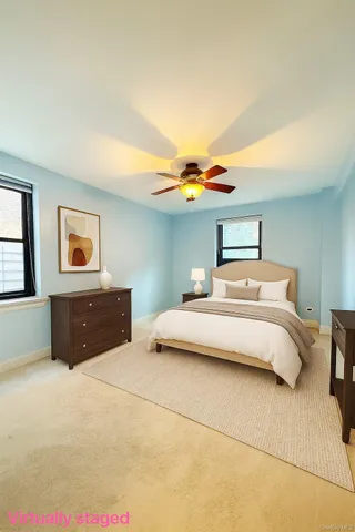 a bedroom with a bed and a night stand