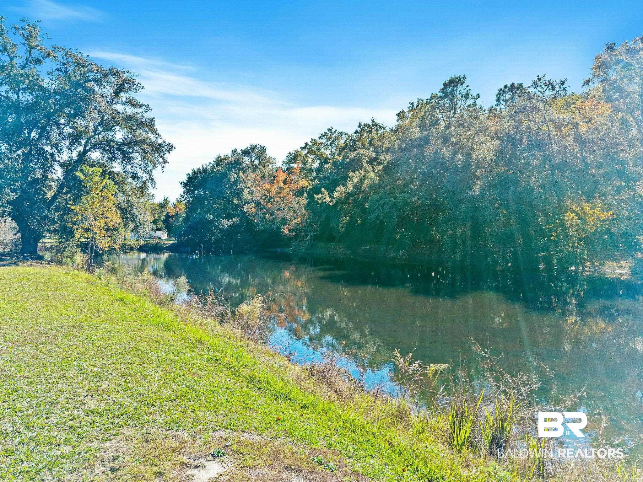 1510 South Juniper Street Foley, AL 36535 - Photo 34 of 36 Water view with a heavily wooded area