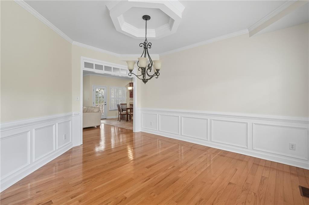 2301 Alexander Farms Court Southwest Marietta, GA 30064 - Photo 16 of 62 a view of a room with wooden floor staircase and a living room