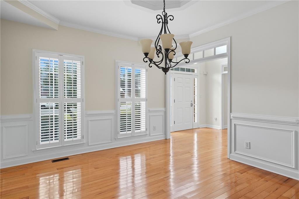 2301 Alexander Farms Court Southwest Marietta, GA 30064 - Photo 19 of 62 a view of a livingroom with a chandelier wooden floor and windows