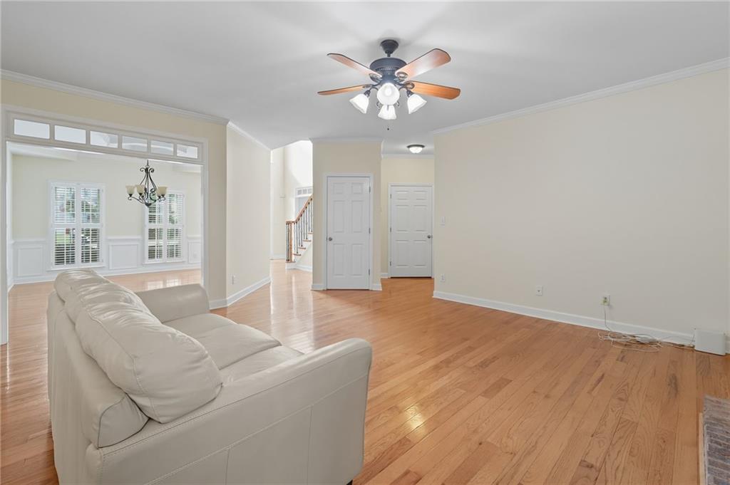 2301 Alexander Farms Court Southwest Marietta, GA 30064 - Photo 31 of 62 a living room with furniture and a chandelier