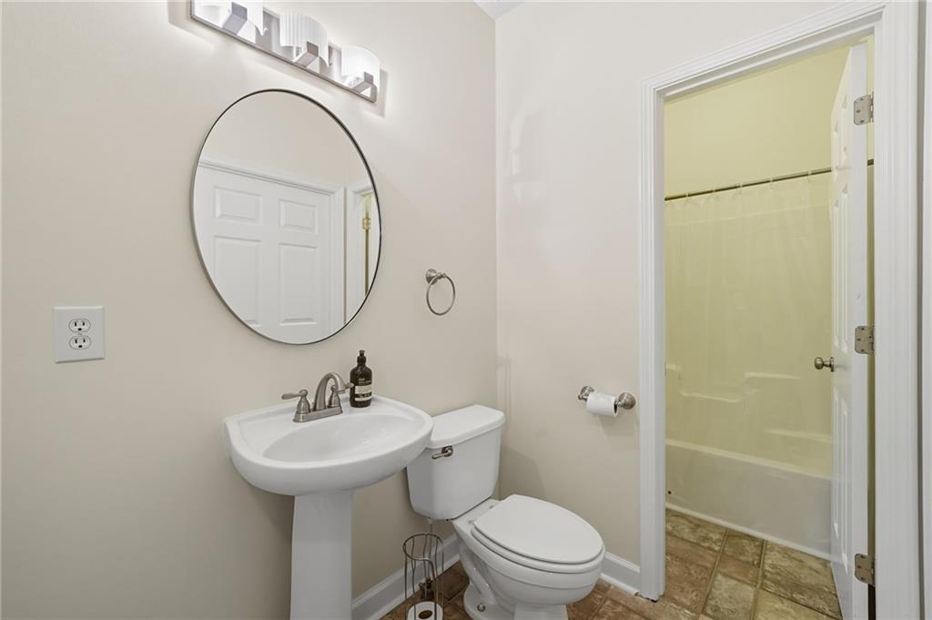 2301 Alexander Farms Court Southwest Marietta, GA 30064 - Photo 32 of 62 a bathroom with a sink toilet and a mirror