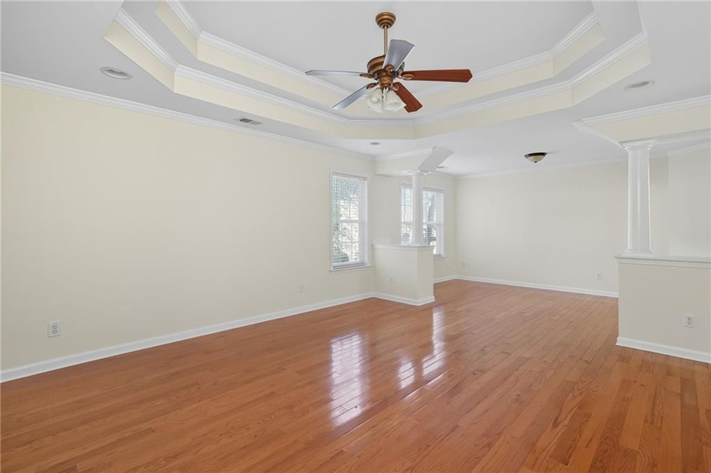 2301 Alexander Farms Court Southwest Marietta, GA 30064 - Photo 38 of 62 a view of empty room with wooden floor and ceiling fan