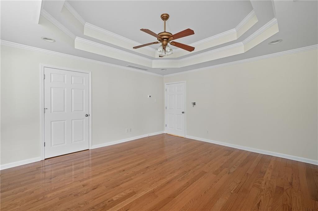 2301 Alexander Farms Court Southwest Marietta, GA 30064 - Photo 40 of 62 a view of a room with wooden floor and a ceiling fan