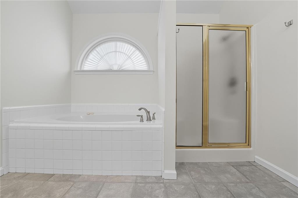 2301 Alexander Farms Court Southwest Marietta, GA 30064 - Photo 43 of 62 a white bath tub sitting next to a shower