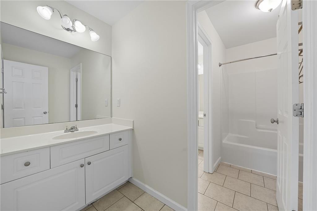 2301 Alexander Farms Court Southwest Marietta, GA 30064 - Photo 46 of 62 a view of bathroom with a sink mirror and shower