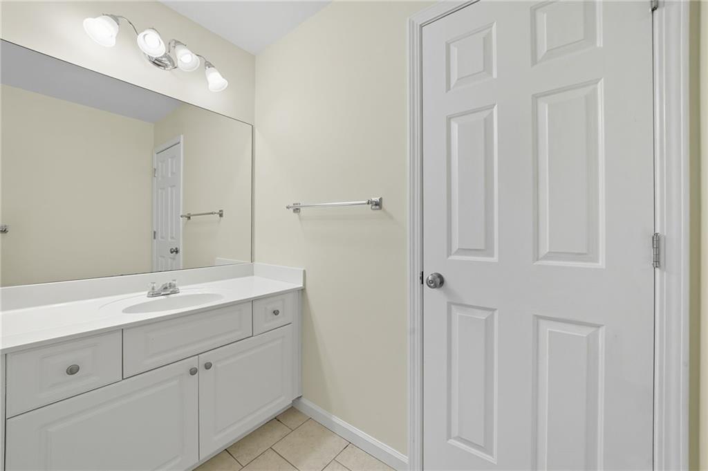2301 Alexander Farms Court Southwest Marietta, GA 30064 - Photo 48 of 62 a spacious bathroom with a double vanity sink mirror and