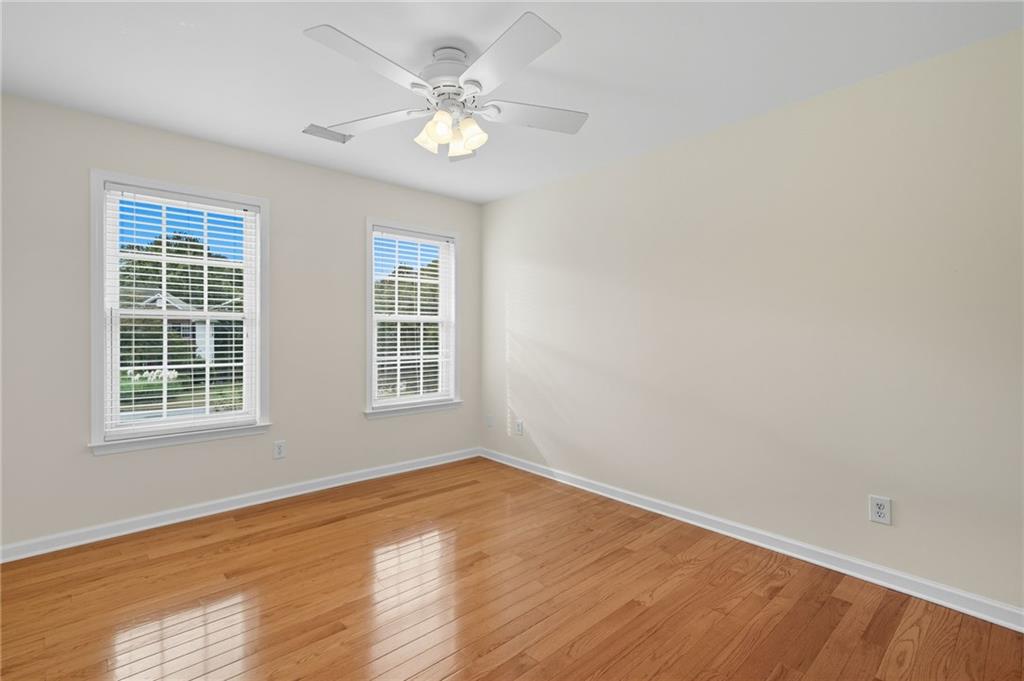 2301 Alexander Farms Court Southwest Marietta, GA 30064 - Photo 51 of 62 an empty room with wooden floor and windows