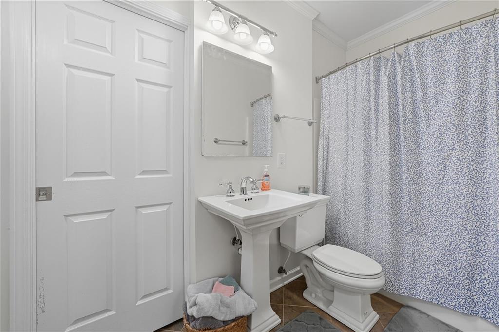 2301 Alexander Farms Court Southwest Marietta, GA 30064 - Photo 53 of 62 a bathroom with a toilet a sink and a mirror