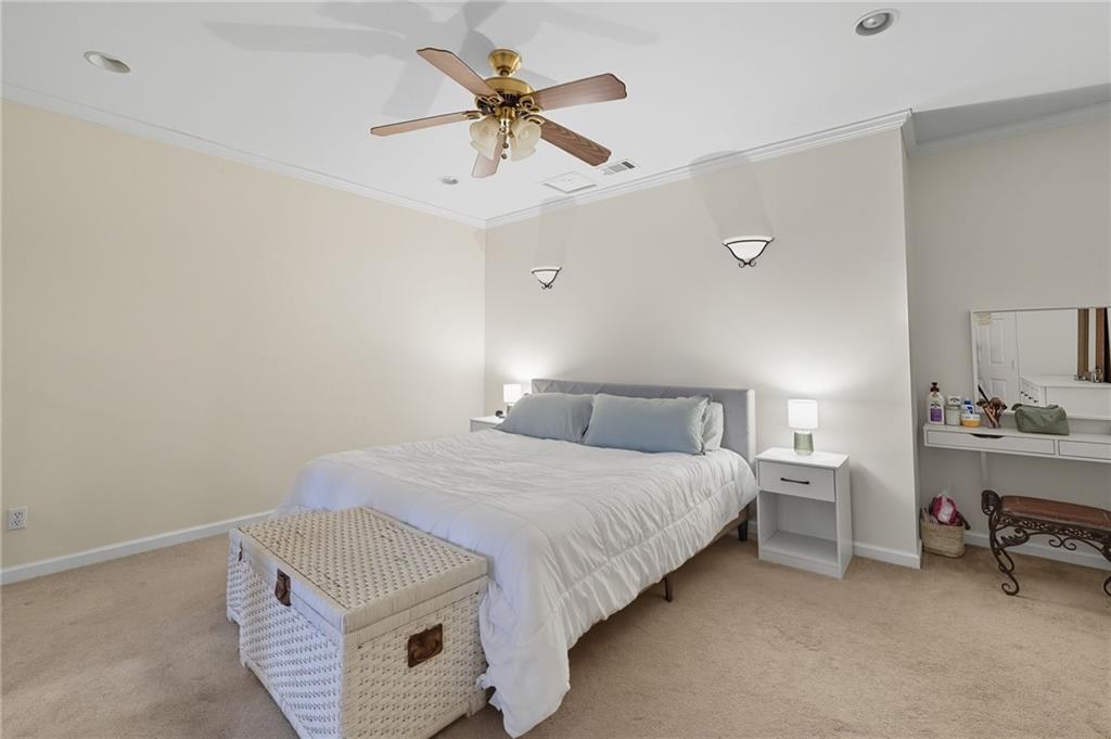 2301 Alexander Farms Court Southwest Marietta, GA 30064 - Photo 54 of 62 a bedroom with a bed and a chandelier