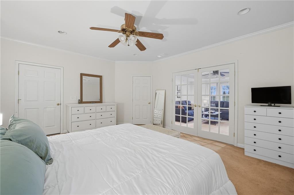 2301 Alexander Farms Court Southwest Marietta, GA 30064 - Photo 55 of 62 a bedroom with a large bed and a tv