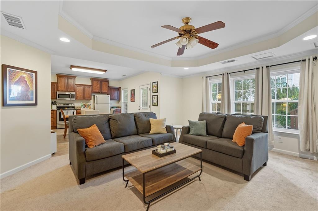 2301 Alexander Farms Court Southwest Marietta, GA 30064 - Photo 57 of 62 a living room with furniture ceiling fan and a window