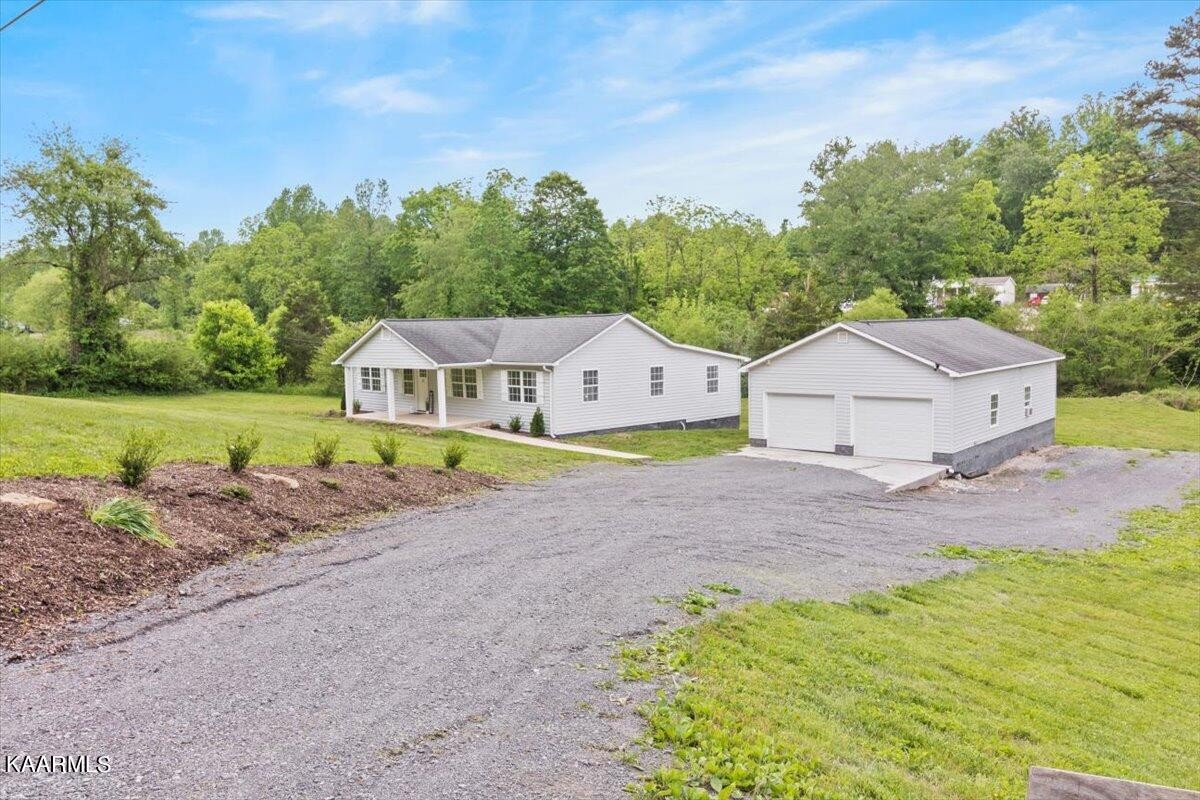 316 Granite Road Clinton, TN 37716 - Photo 1 of 26 a house view with a outdoor space