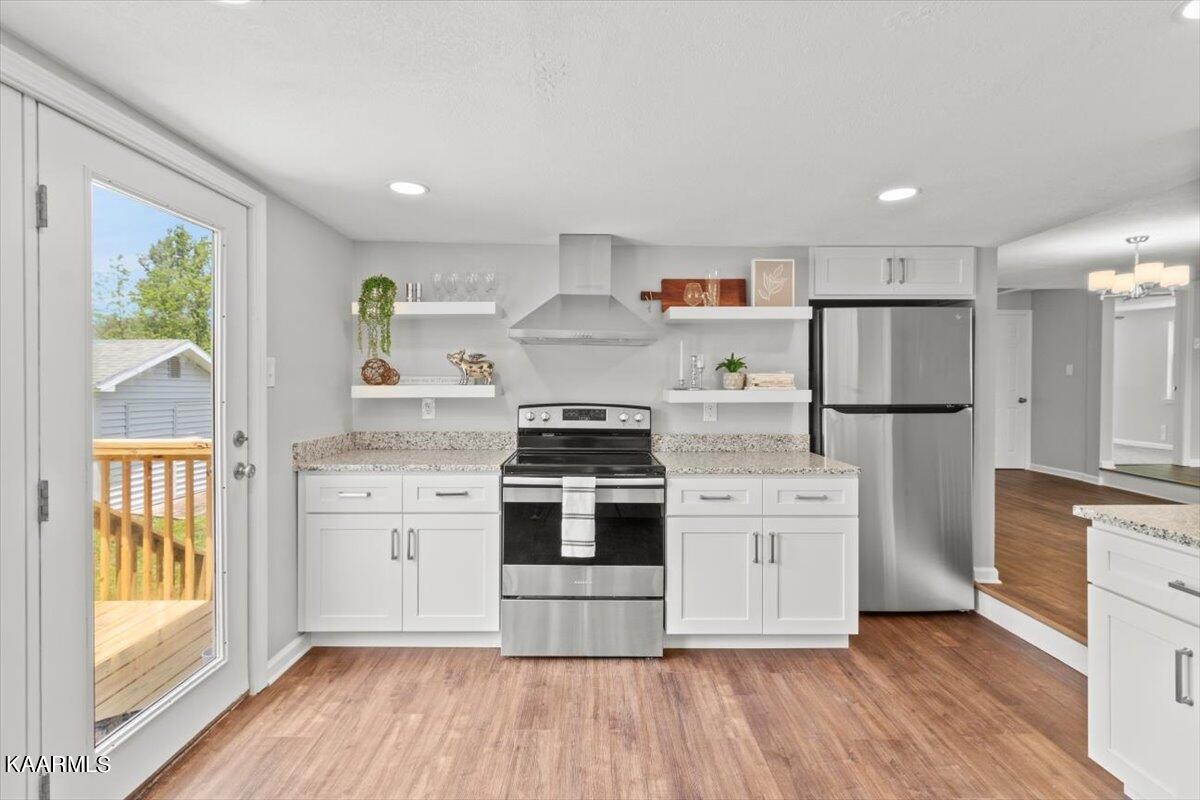316 Granite Road Clinton, TN 37716 - Photo 15 of 26 a kitchen with stainless steel appliances a stove a refrigerator and a more cabinets