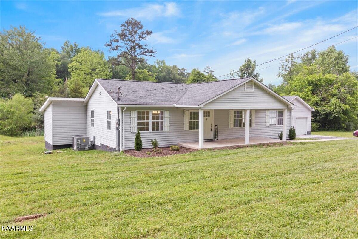 316 Granite Road Clinton, TN 37716 - Photo 2 of 26 a view of a house with a yard