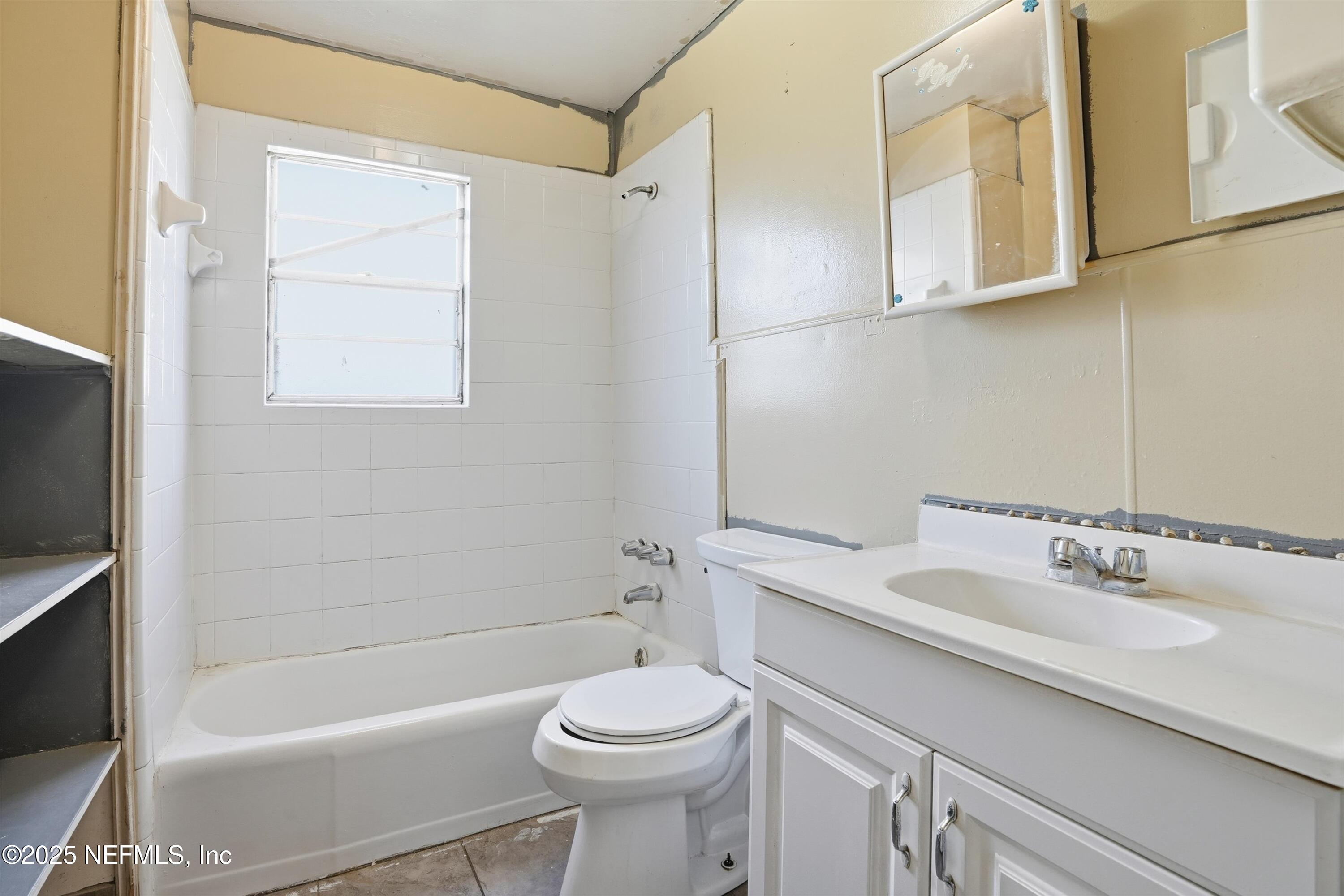 11558 Raft Road Jacksonville, FL 32218 - Photo 31 of 32 a bathroom with a sink a toilet and shower