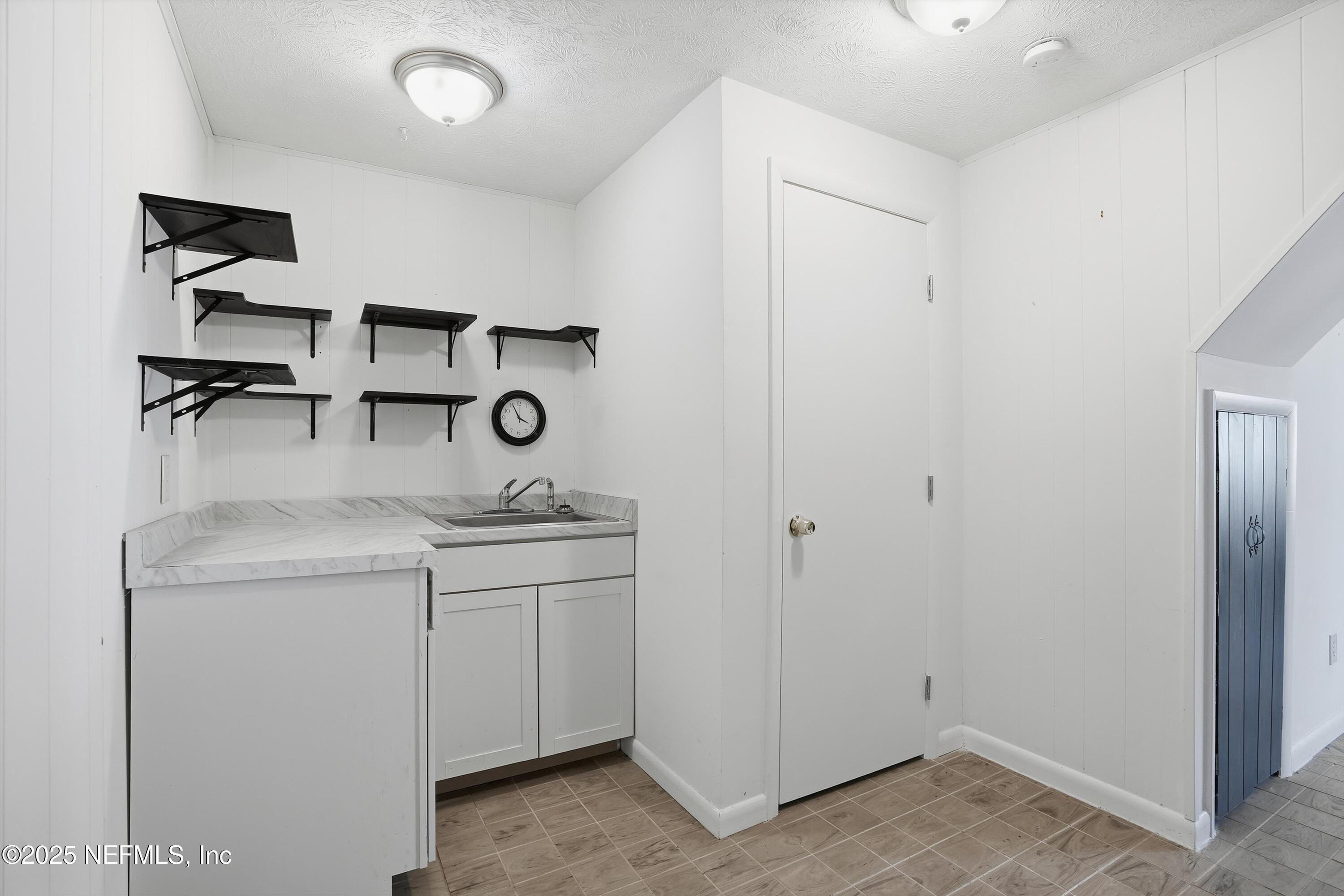 11558 Raft Road Jacksonville, FL 32218 - Photo 10 of 32 a view of cabinets and sink