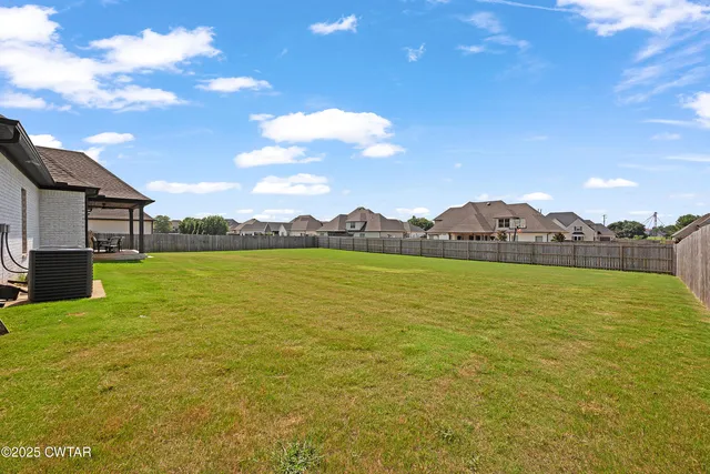 a view of a lake and a yard