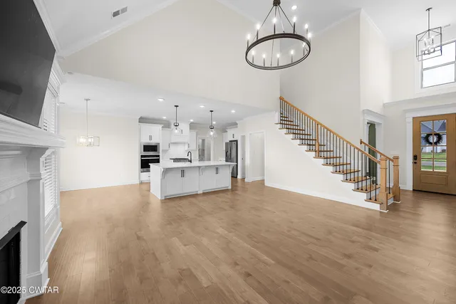 a view of kitchen and hall with wooden floor