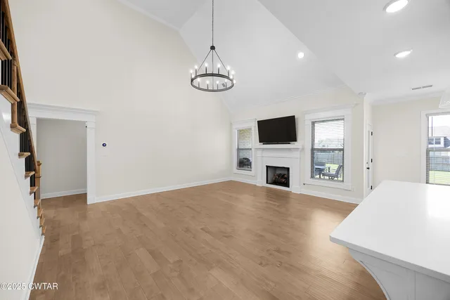 a view of a livingroom with an empty space and a fireplace