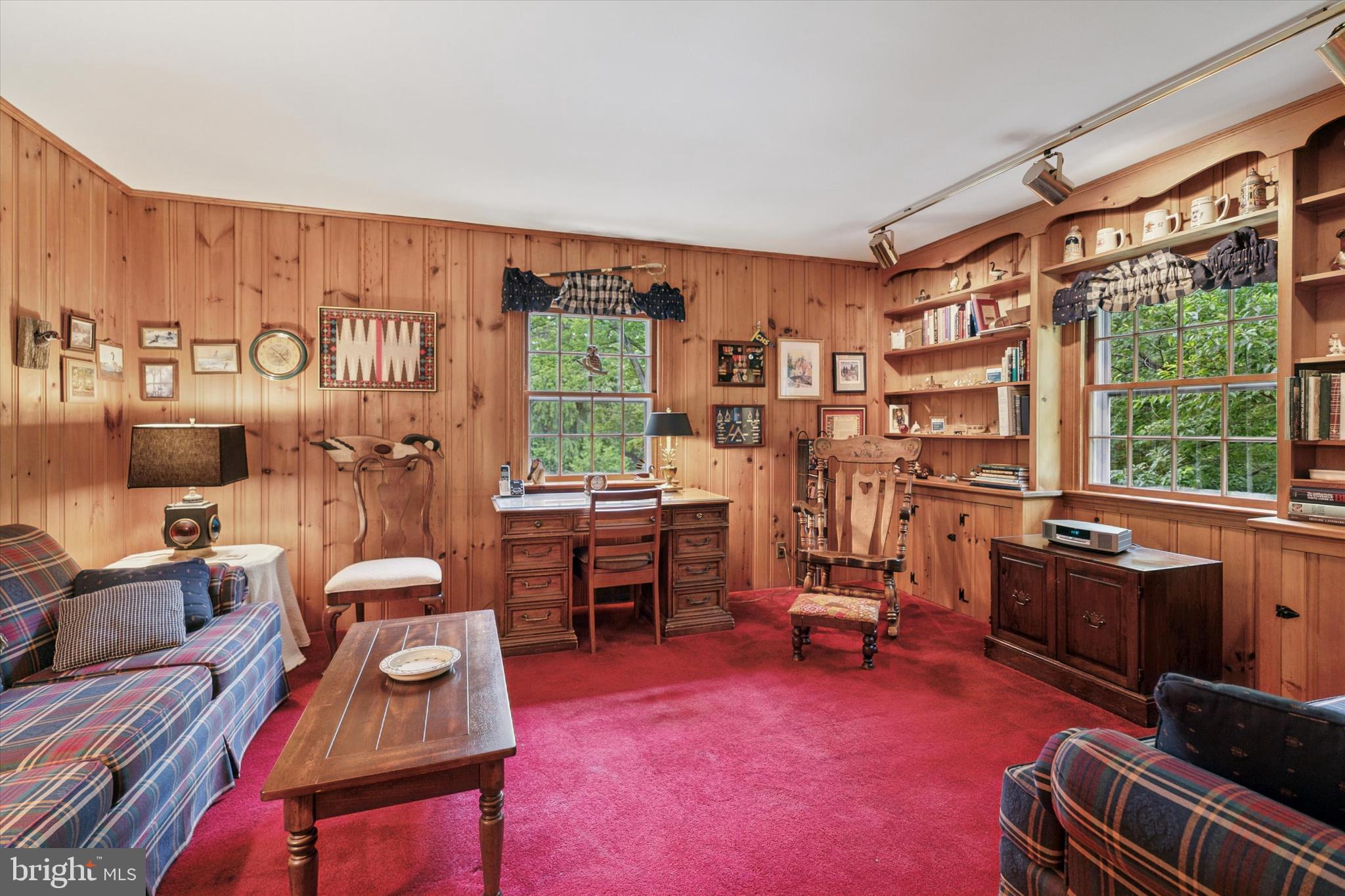 240 Rices Mill Road Wyncote, PA 19095 - Photo 17 of 36 a living room with furniture a fireplace and large windows