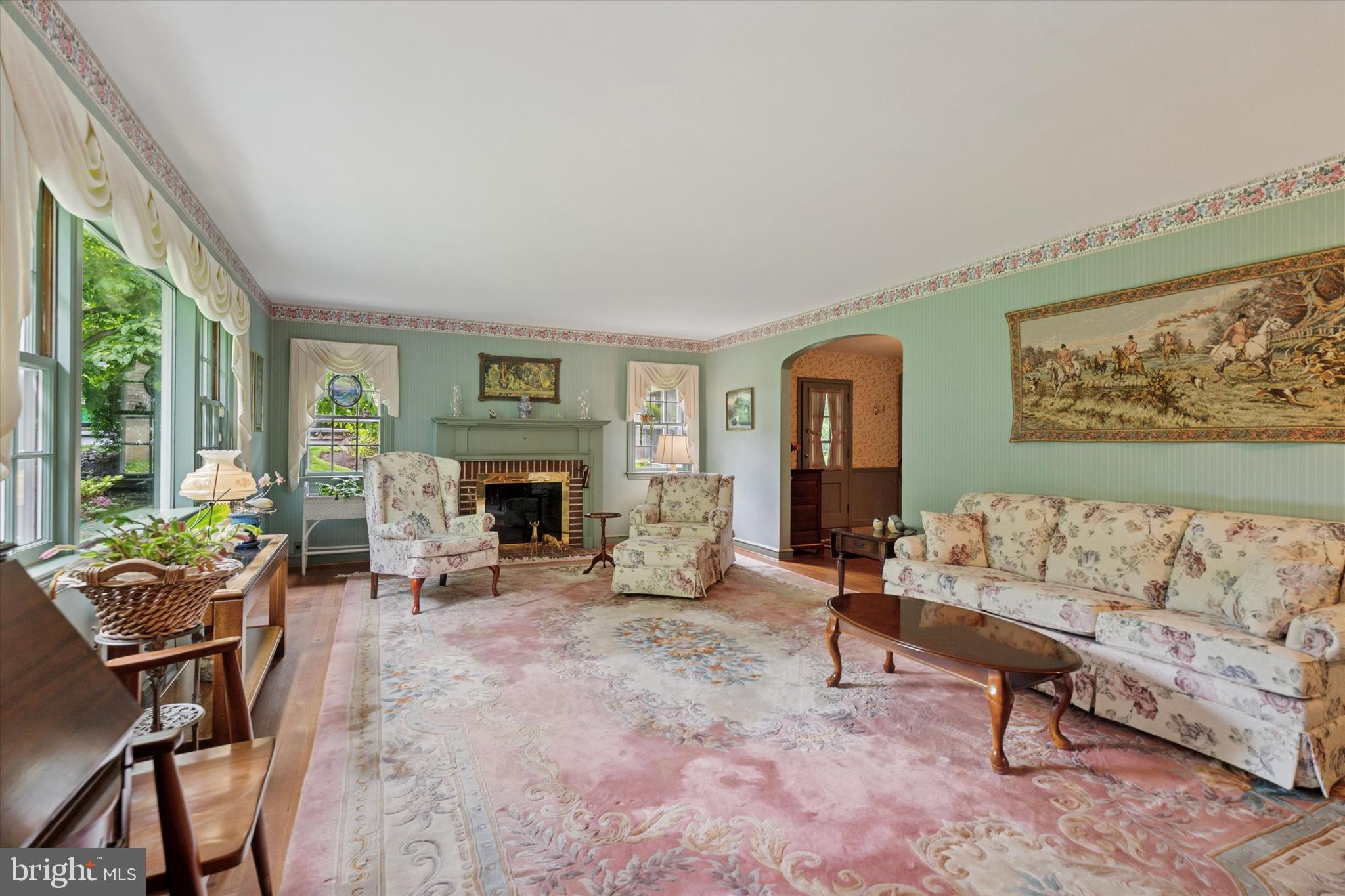 240 Rices Mill Road Wyncote, PA 19095 - Photo 3 of 36 a living room with furniture and a fireplace